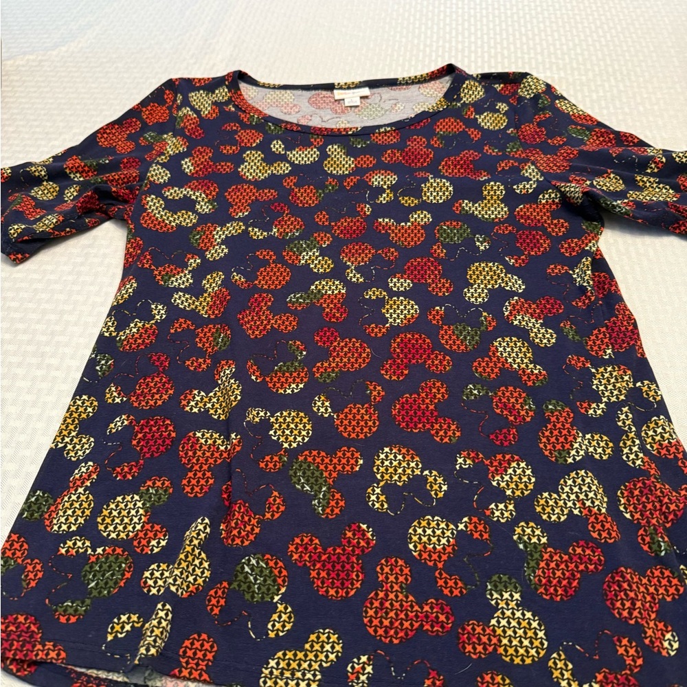 Disney LuLaRoe Navy Top with Red and Green Patterns